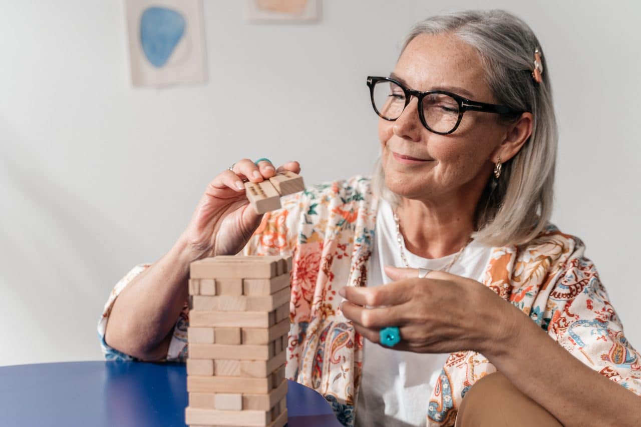 Woman putting together a puzzle.