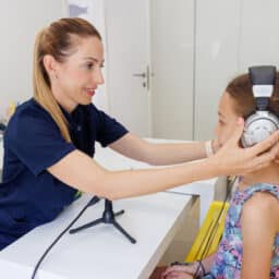 Young girl in a school ear exam