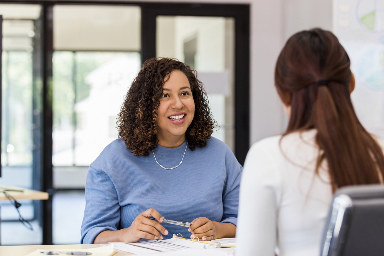 Two woman having a pleasant conversation.