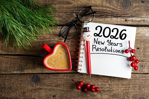 2026 New Year's resolution notebook with holiday charms.